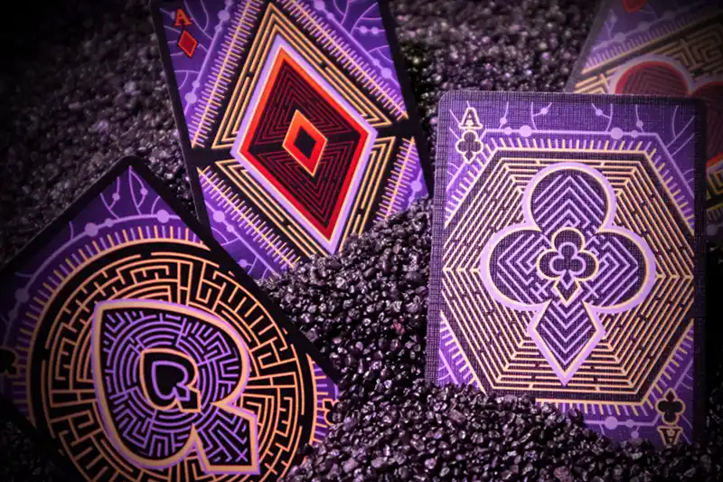 Fascinating colors, rarely found in nature. Turquoise symbolizing immortality and eternity, and the amethyst color that helps to keep a sober mind and control raging senses. Both are broken with royal gold and dark black, giving the decks a disturbingly fascinating character.