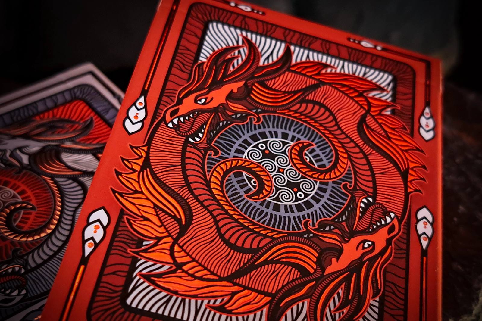 A deck of 55 poker format cards representing a more grim and ominous side of the Edge of Chaos. Red and black are the dominant colors.